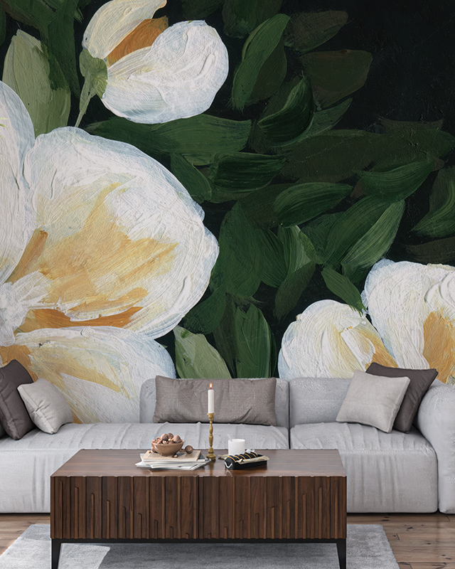 eco-friendly-wallpaper-featuring-large-white-flowers-and-green-leaves-with-a-gray-sofa-and-wooden-table-in-front Eco-friendly wallpaper featuring large white flowers and green leaves, with a gray sofa and wooden table in front
