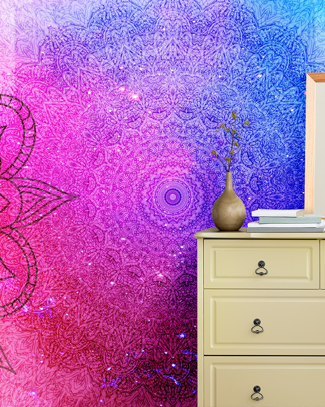 Intricate mandala design transitioning from pink to purple and blue, highlighting blue wallpaper trends