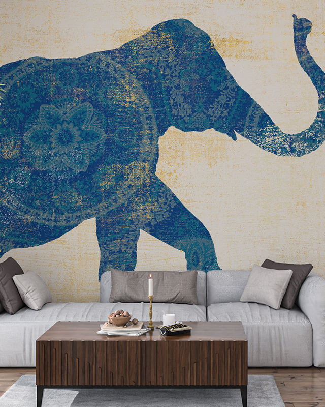 Living room with sofa, wooden table, and artistic elephant blue wallpaper trends creating a modern focal point