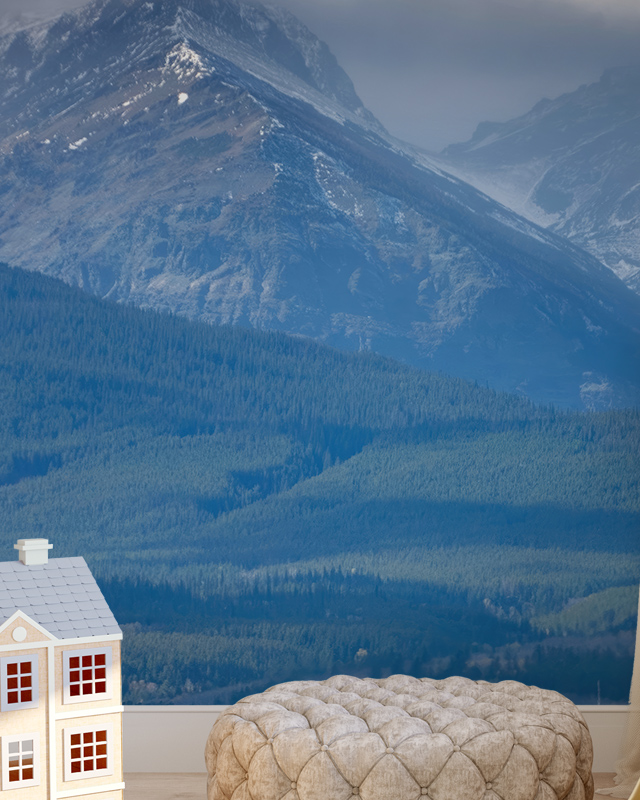 room-with-mountain-themed-wallpaper-and-lighting-featuring-a-beige-pouf-and-a-small-toy-house Room with mountain-themed wallpaper and lighting, featuring a beige pouf and a small toy house