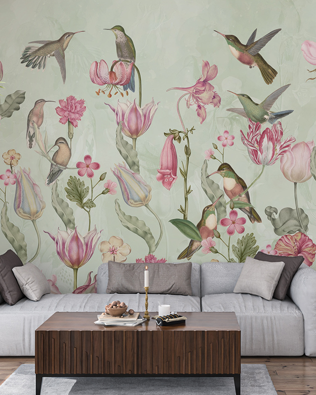 Floral Wallpaper Trend featuring colorful hummingbirds and flowers on a light background. In front of the wallpaper, a modern living room setup with a wooden coffee table and gray sofa. Floral Wallpaper Trend featuring colorful hummingbirds and flowers on a light background. In front of the wallpaper, a modern living room setup with a wooden coffee table and gray sofa.