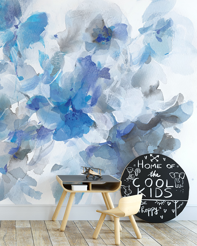 Floral Wallpaper Trend with large abstract blue and gray watercolor flowers. In front of the wallpaper are a small table, chair, and blackboard. Floral Wallpaper Trend with large abstract blue and gray watercolor flowers. In front of the wallpaper are a small table, chair, and blackboard.