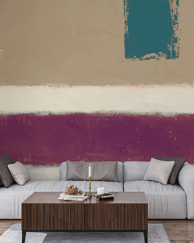 Modern living room with abstract wallpaper installation featuring bold blocks of teal, beige, and maroon behind a gray sofa