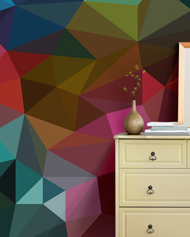 a-dresser-is-set-against-abstract-wallpaper-for-accent-walls-featuring-geometric-patterns-in-bold-multicolored-shades A dresser is set against abstract wallpaper for accent walls featuring geometric patterns in bold, multicolored shades