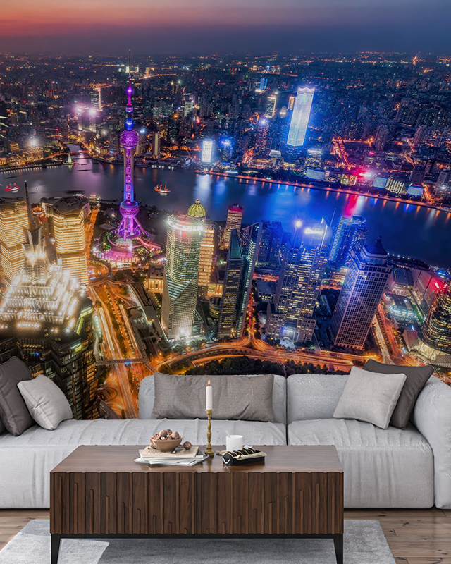 A living room with a vibrant cityscape wallpaper showcasing a nighttime skyline, illustrating the Comparison of Abstract Wallpaper with Other Styles