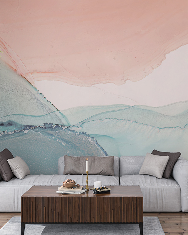 Abstract pastel wallpaper installation behind a modern sofa and wooden coffee table