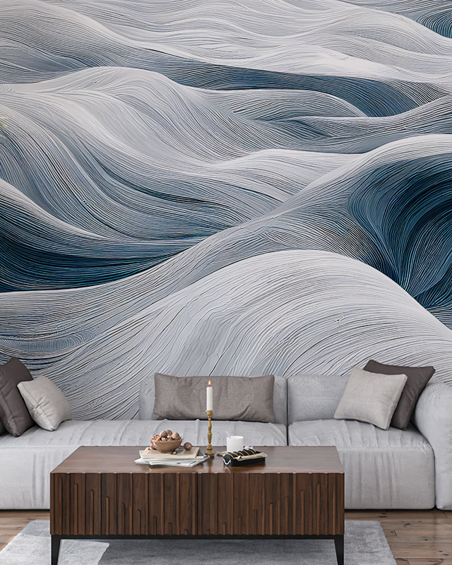 Abstract wallpaper featuring fluid, wave-like patterns in gray and blue tones. In front, a wooden table with gray sofa with cushions, used comparison of abstract wallpaper with other styles.