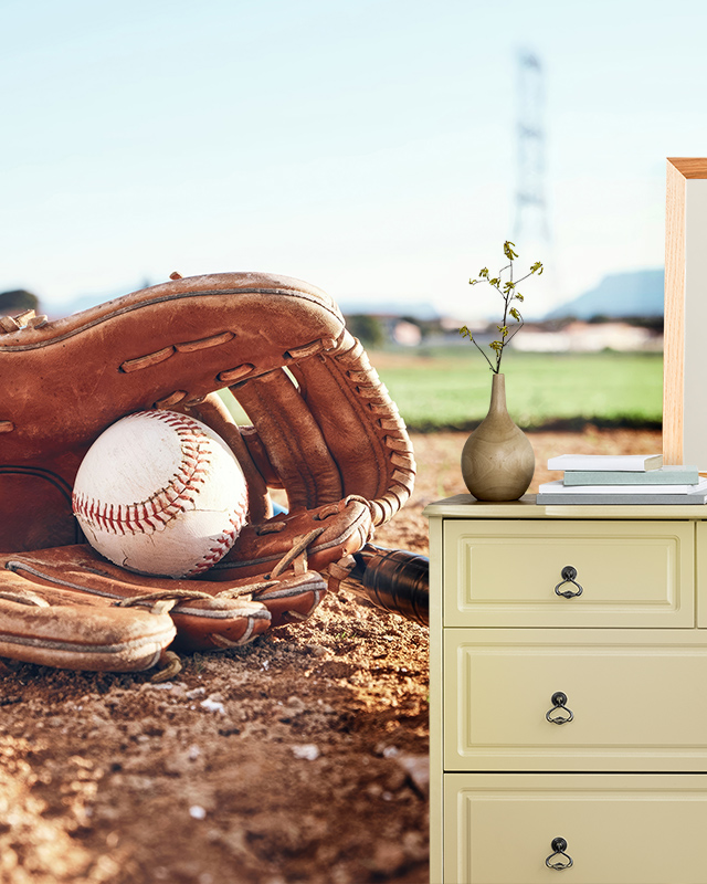 baseball-themed-sports-wallpaper-for-man-caves-featuring-a-close-up-of-a-glove-and-ball-next-to-a-dresser Baseball-themed sports wallpaper for man caves featuring a close-up of a glove and ball, next to a dresser.