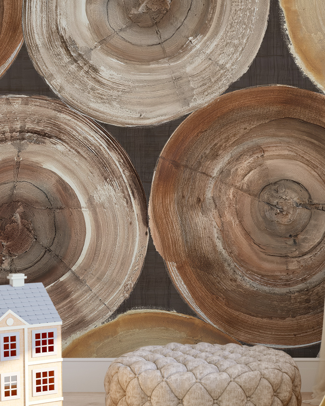 Close-up of tree ring patterns on wallpaper with a tufted ottoman and a toy house in front, illustrating Comparison of Abstract Wallpaper with Other Styles