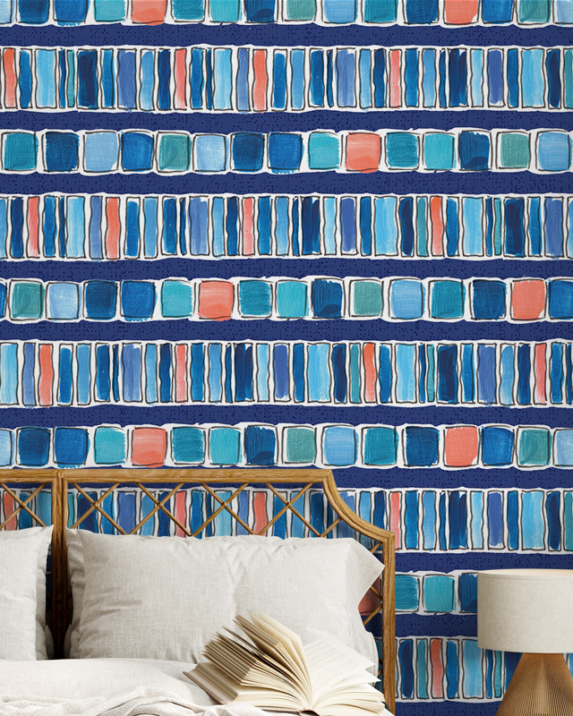Colorful abstract wallpaper with rows of blue, teal, and coral squares behind a rattan headboard and open book, illustrating Comparison of Abstract Wallpaper with Other Styles