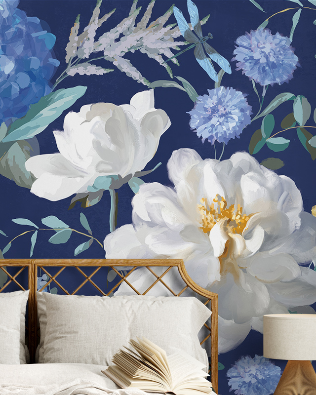 floral-wallpaper-for-accent-walls-with-large-white-and-blue-flowers-in-front-of-a-bed-with-beige-pillows Floral Wallpaper for Accent Walls with large white and blue flowers in front of a bed with beige pillows.