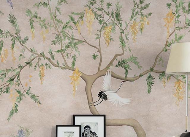 Living room with beige wallpaper featuring a tree branch and crane motif, highlighting Beige Wallpaper Trends.