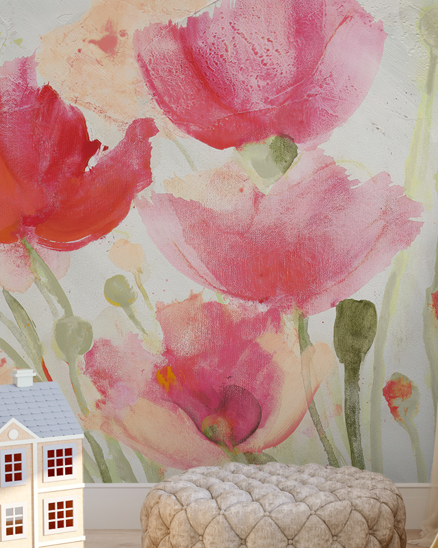 Playful floral wallpaper for different rooms featuring large, abstract pink and red poppies. The room includes a tufted beige ottoman and a small model house, adding a whimsical touch.