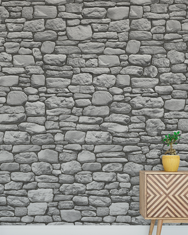 Stone-patterned wallpaper with a wooden cabinet and potted plant in front, illustrating Comparison of Abstract Wallpaper with Other Styles