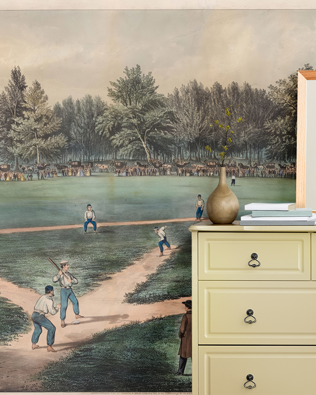 vintage-baseball-game-wallpaper-in-front-of-a-dresser-with-books-and-a-vase-illustrating-types-of-sports-wallpapers Vintage baseball game wallpaper in front of a dresser with books and a vase, illustrating Types of Sports Wallpapers.