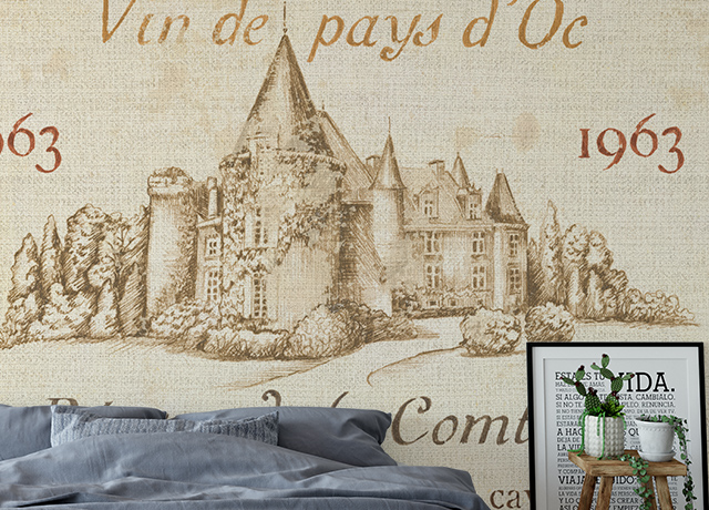 A bedroom featuring Retro 60s & 70s Vintage Wallpaper with a wine label design and a sketch of a château.