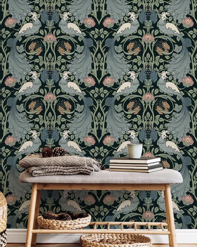 a-bench-with-stacked-books-in-front-of-intricate-william-morris-wallpaper-patterns-featuring-birds-and-floral-designs A bench with stacked books in front of intricate William Morris wallpaper patterns featuring birds and floral designs.
