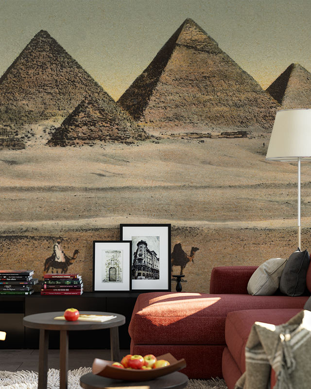 a-living-room-featuring-modern-interiors-with-vintage-wallpaper-depicting-pyramids-camels-framed-art-and-a-red-sofa A living room featuring Modern Interiors with Vintage Wallpaper depicting pyramids, camels, framed art, and a red sofa.
