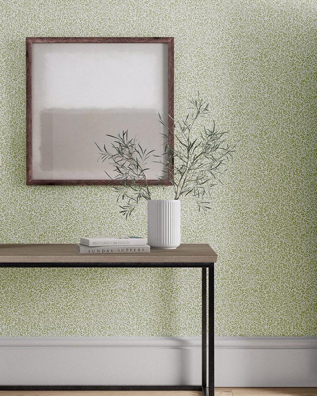 a-minimalist-room-featuring-william-morris-wallpaper-with-modern-art-a-framed-abstract-painting-and-a-small-vase A minimalist room featuring William Morris wallpaper with modern art, a framed abstract painting, and a small vase.