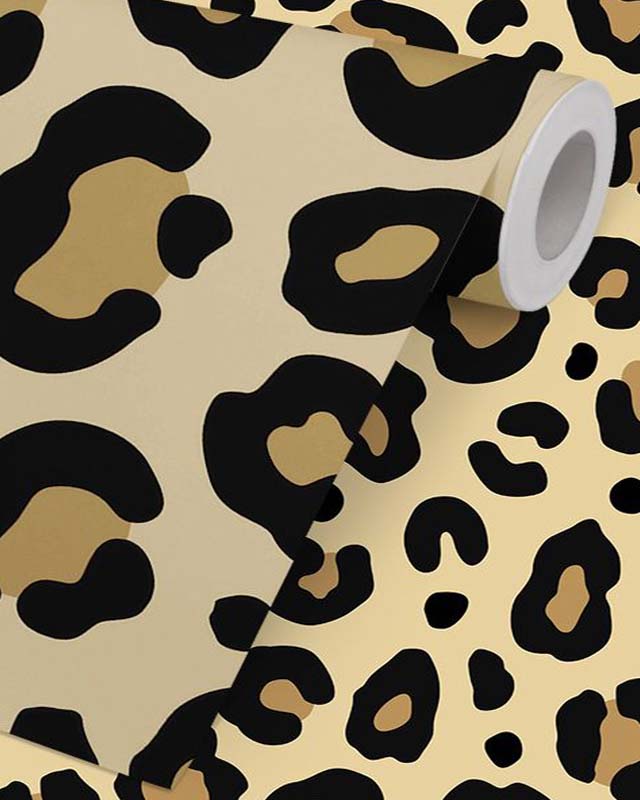 a-roll-of-leopard-print-remove-removable-wallpaper-featuring-bold-black-and-tan-spots-on-a-beige-background A roll of leopard-print remove removable wallpaper featuring bold black and tan spots on a beige background