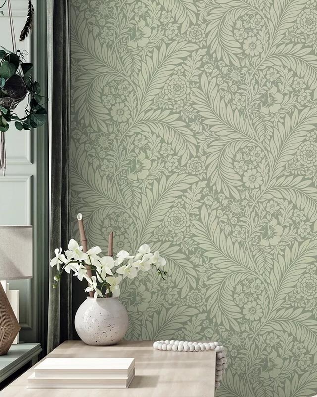 a-serene-room-featuring-soft-green-william-morris-wallpaper-with-modern-art-decor-and-a-vase-of-white-flowers A serene room featuring soft green William Morris Wallpaper with Modern Art decor and a vase of white flowers.