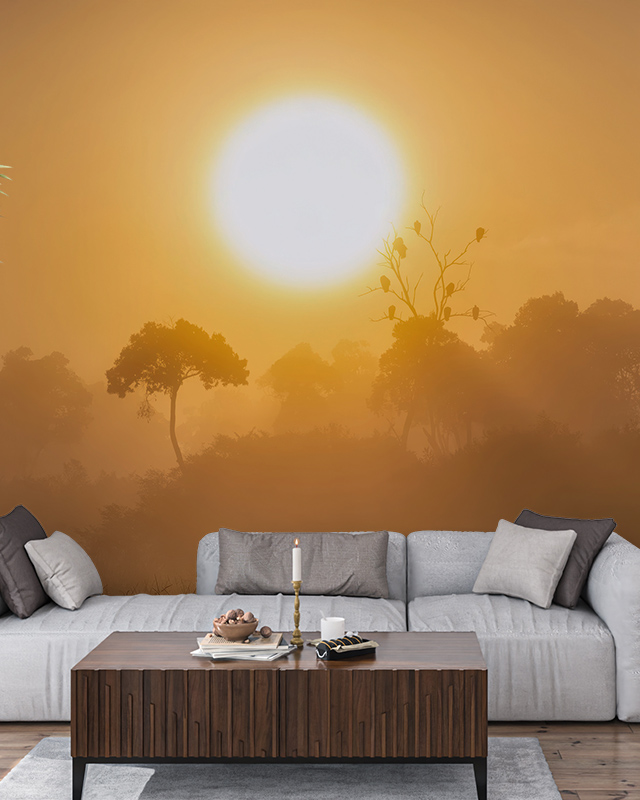 a-serene-sunrise-scene-with-trees-silhouetted-against-an-orange-sky-ideal-wallpaper-for-different-workplaces-for-calm-environments A serene sunrise scene with trees silhouetted against an orange sky, ideal Wallpaper for Different Workplaces for calm environments.