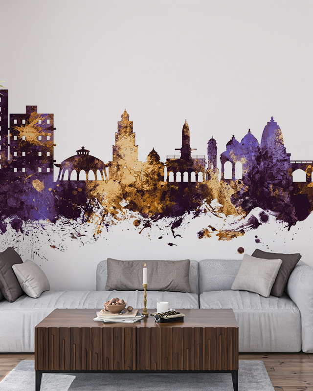 abstract-city-skyline-wallpaper-in-purple-and-gold-tones-with-splatter-design-behind-a-grey-sofa-ideal-peel-and-stick-office-wallpaper Abstract city skyline wallpaper in purple and gold tones with splatter design behind a grey sofa. Ideal peel-and-stick office wallpaper.