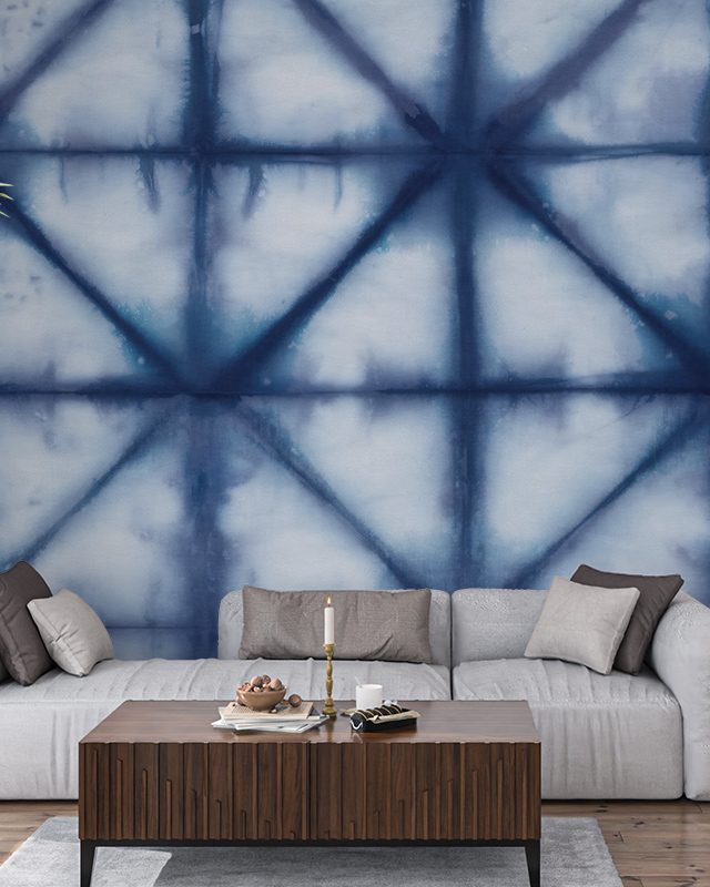 abstract-indigo-tie-dye-wallpaper-with-geometric-patterns-behind-a-grey-sofa-ideal-wallpaper-for-open-office-layouts Abstract indigo tie-dye wallpaper with geometric patterns behind a grey sofa. Ideal wallpaper for open office layouts.