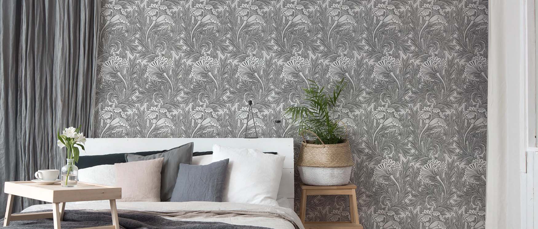 bedroom-with-grey-william-morris-wallpaper-patterns-white-bedding-indoor-plant-in-woven-basket-and-wooden-bedside-table Bedroom with grey William Morris wallpaper patterns, white bedding, indoor plant in woven basket, and wooden bedside table.
