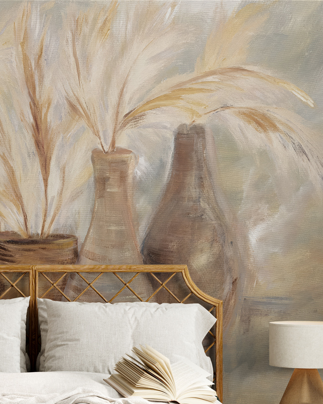 Beige Wallpaper for nursery featuring painted vases and pampas grass behind a wicker headboard with neutral bedding.