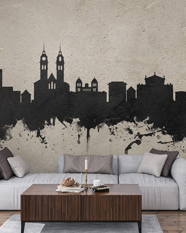 black-city-skyline-wallpaper-with-splatter-effect-on-a-textured-beige-background-behind-a-grey-sofa-perfect-peel-and-stick-office-wallpaper Black city skyline wallpaper with splatter effect on a textured beige background behind a grey sofa. Perfect peel-and-stick office wallpaper.