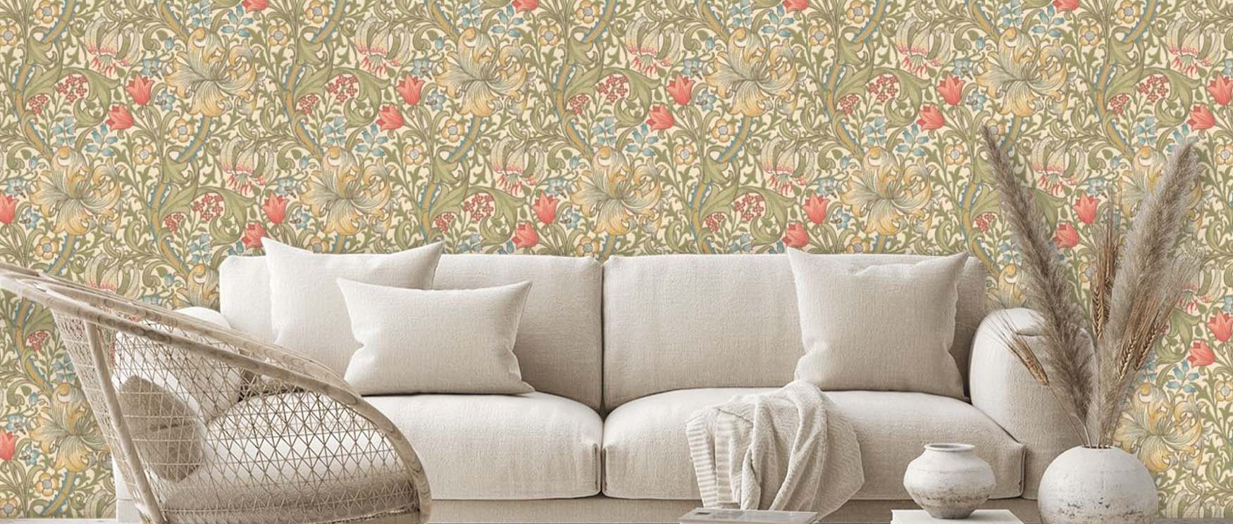 cream-sofa-with-cushions-in-front-of-intricate-floral-william-morris-wallpaper-patterns-complemented-by-dried-floral-decor Cream sofa with cushions in front of intricate floral William Morris wallpaper patterns, complemented by dried floral decor.