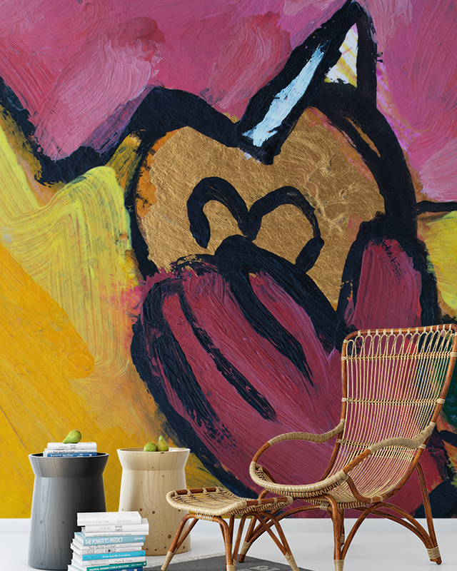 Designing Accent Walls with teens room wallpaper featuring bold abstract art in pink, yellow, and black, with a wicker chair, small tables, and a stack of books in the foreground.