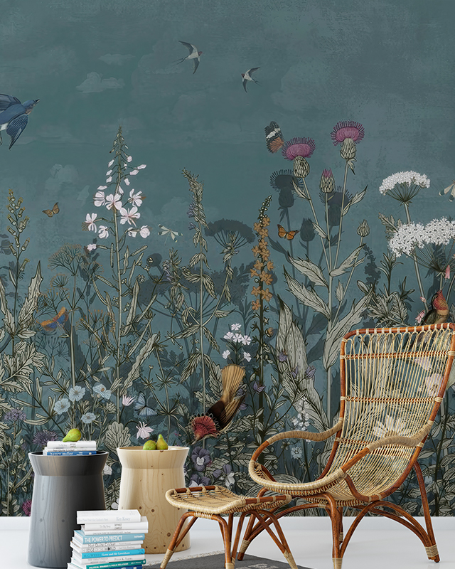 Designing Accent Walls with teens room wallpaper featuring wildflowers, birds, butterflies, wicker chair, and stacked books.