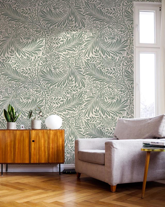 mid-century-modern-living-room-with-william-morris-vs-modern-wallpaper-styles-featuring-leafy-green-wallpaper-and-wooden-cabinet Mid-century modern living room with William Morris vs. Modern Wallpaper Styles, featuring leafy green wallpaper and wooden cabinet.