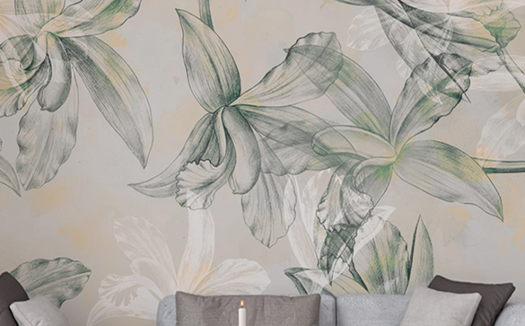 Office wallpaper for branding featuring oversized floral designs in soft tones, paired with a modern sofa and decor.