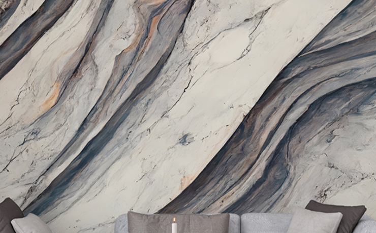 Peel-and-stick office wallpaper with abstract marble design, featuring a grey sofa, wooden coffee table, and candles.