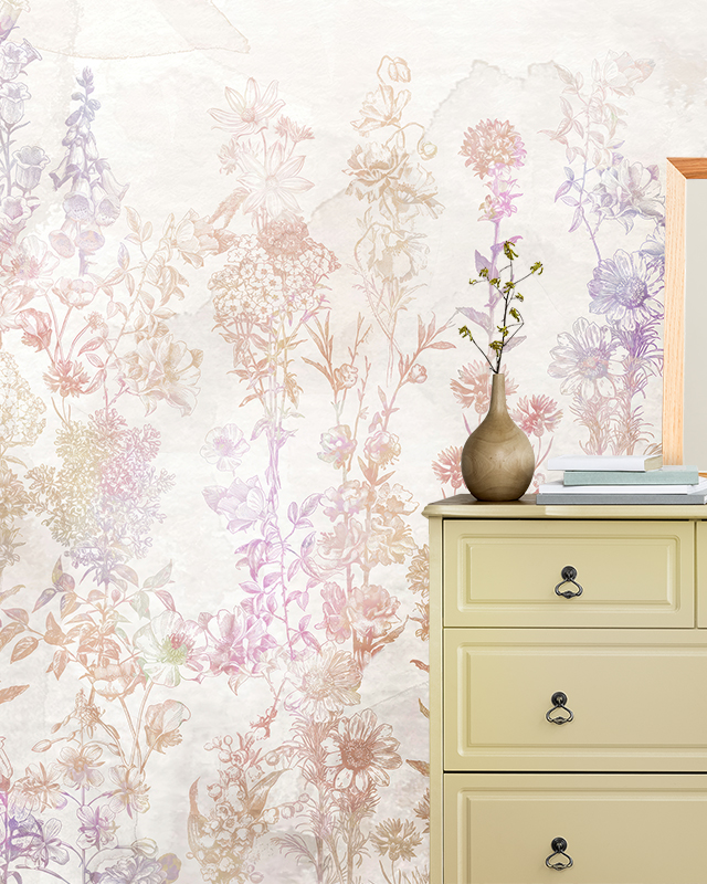 Room with a dresser, vase, and books in front of Beige Wallpaper for nursery featuring pastel floral designs.