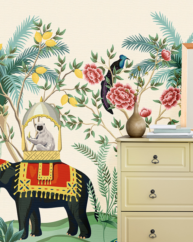 Room with dresser, vase, and books in front of Beige Wallpaper for nursery featuring an elephant, lemur, and floral patterns.