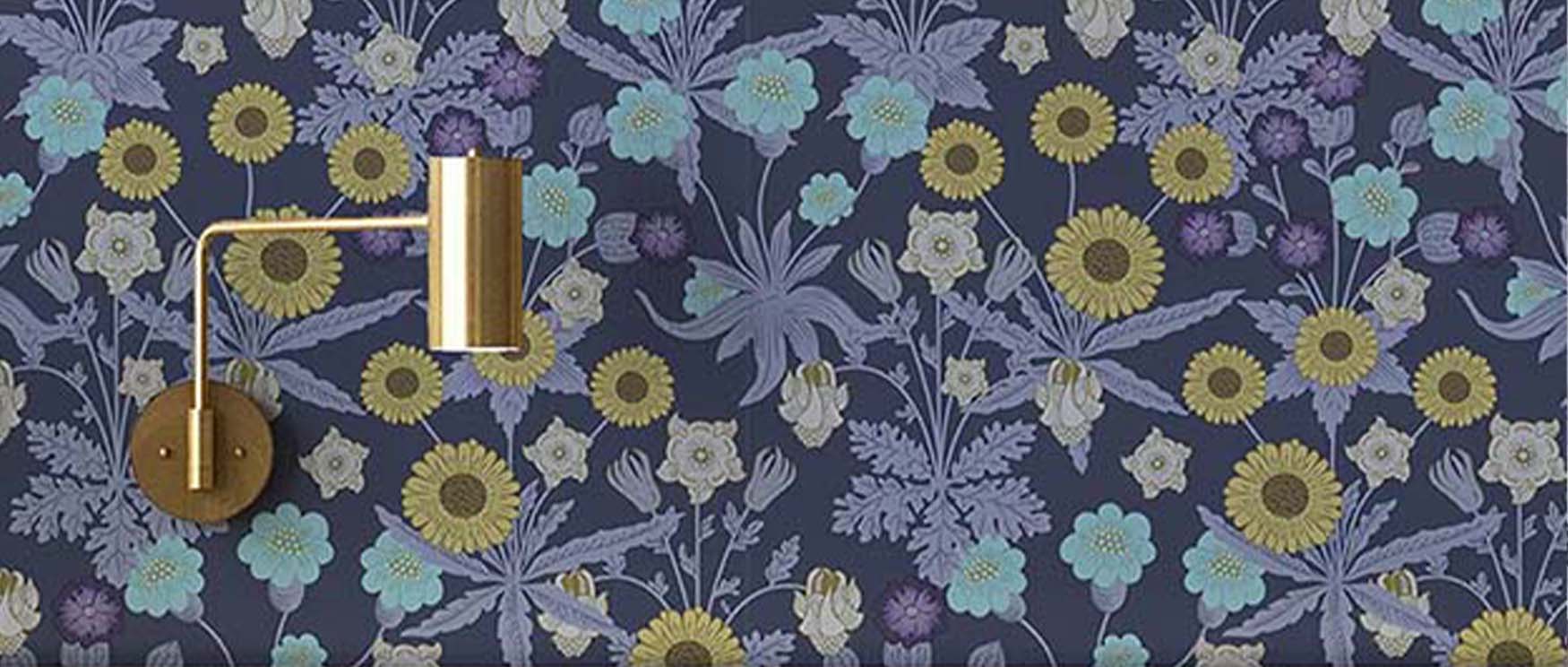 vibrant-william-morris-wallpaper-with-modern-art-features-highlighted-by-a-sleek-brass-wall-sconce Vibrant William Morris wallpaper with modern art features, highlighted by a sleek brass wall sconce.