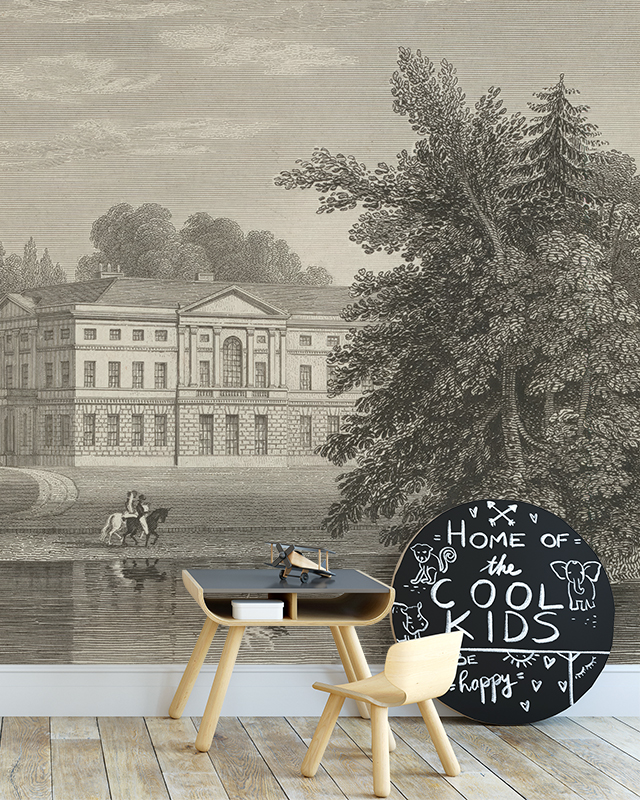 Vintage Wallpaper for Accent Walls showing a historic mansion and trees, with a child's desk and chalkboard in front.