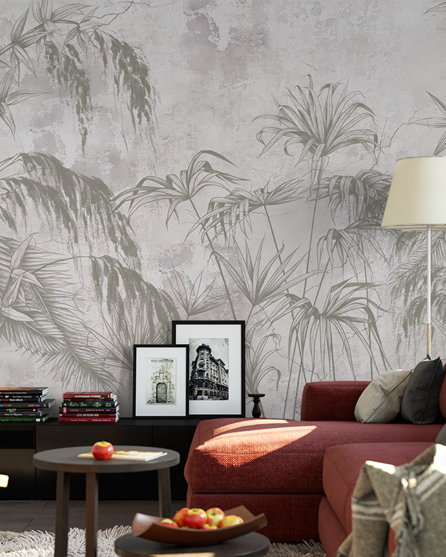 vintage-wallpapers-for-large-spaces-featuring-soft-tropical-leaf-designs-with-a-red-sofa-and-framed-artwork Vintage wallpapers for large spaces featuring soft tropical leaf designs, with a red sofa and framed artwork.