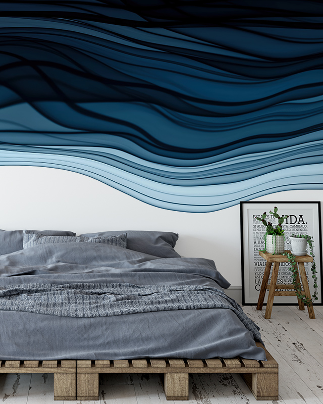 wavy-blue-peel-and-stick-wallpaper-trends-over-a-minimalist-bed-with-a-wooden-pallet-frame-and-modern-decor-accents Wavy blue Peel and Stick Wallpaper trends over a minimalist bed with a wooden pallet frame and modern decor accents.