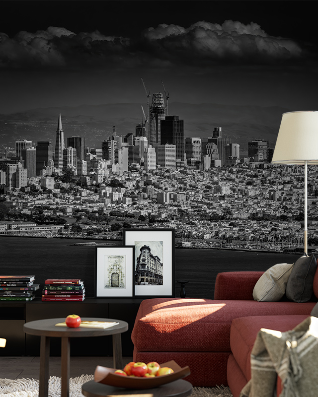 A living room features a black-and-white cityscape mural, blending urban industrial vs. urban chic wallpaper styles.