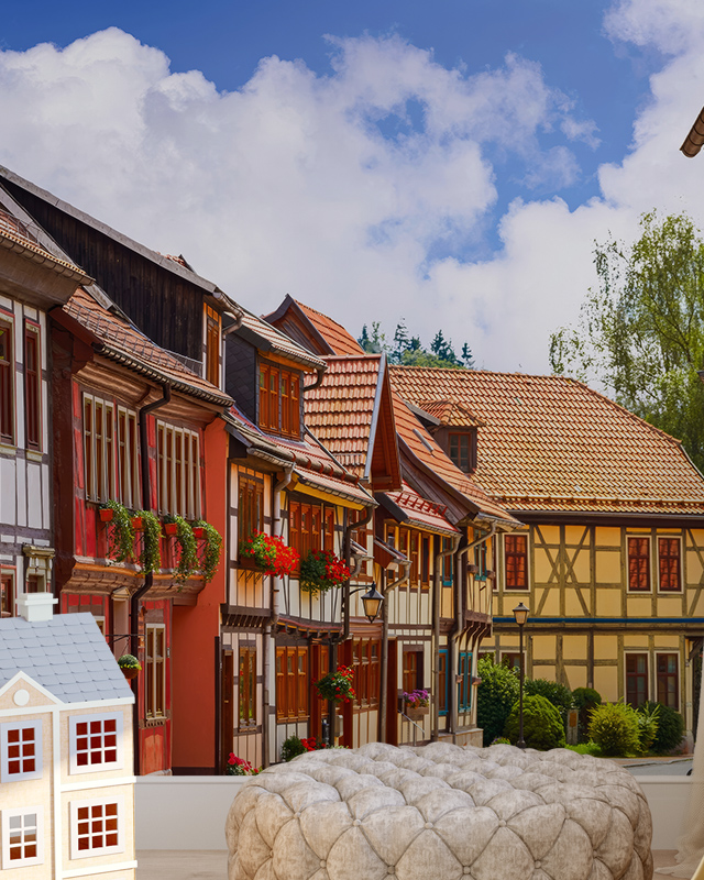a-vibrant-village-street-scene-with-colorful-houses-perfect-as-bright-wallpaper-for-different-design-styles A vibrant village street scene with colorful houses, perfect as bright wallpaper for different design styles.