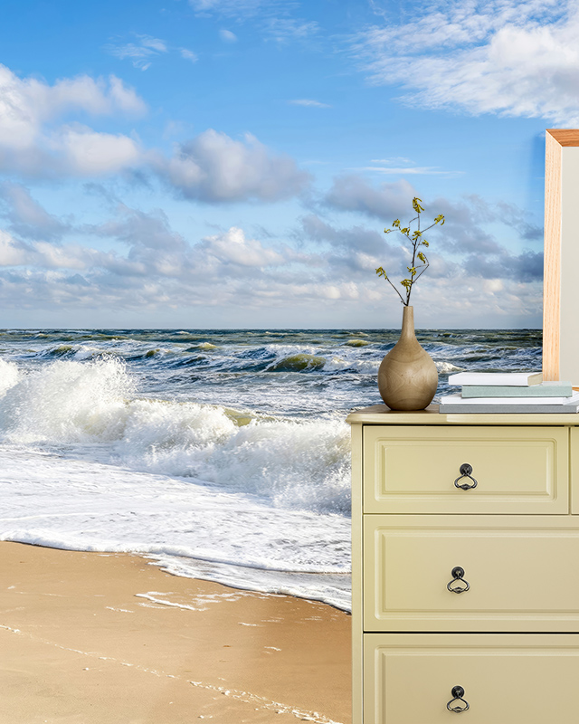 Beach wave mural with sandy shore and bright skies, offering room-by-room bright wallpaper ideas for serene spaces.