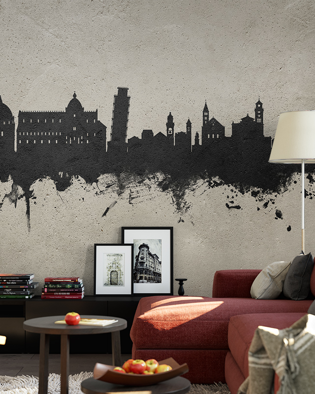 Living room with a black city skyline mural on a textured wall, highlighting types of urban wallpaper designs.