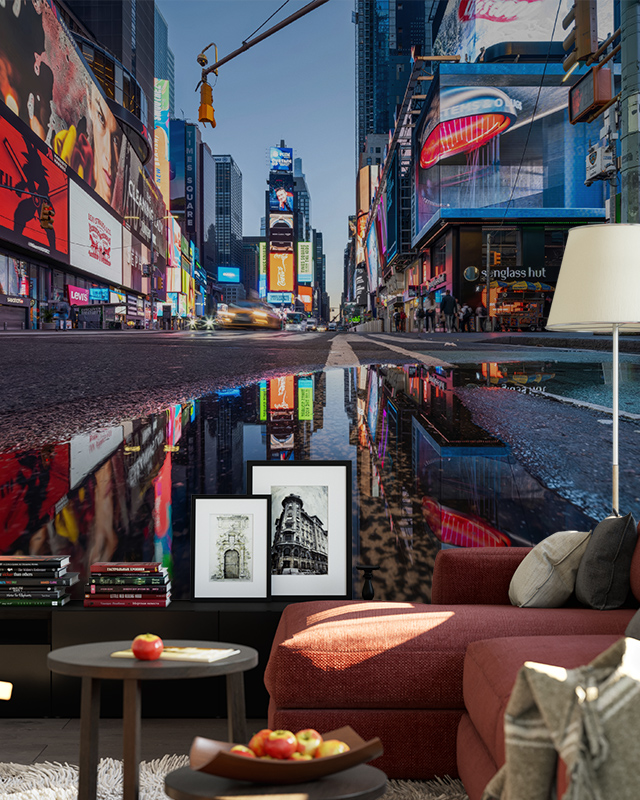 Living room with a mural of a vibrant city street at night, featuring neon signs and reflections, showcasing types of urban wallpaper designs.
