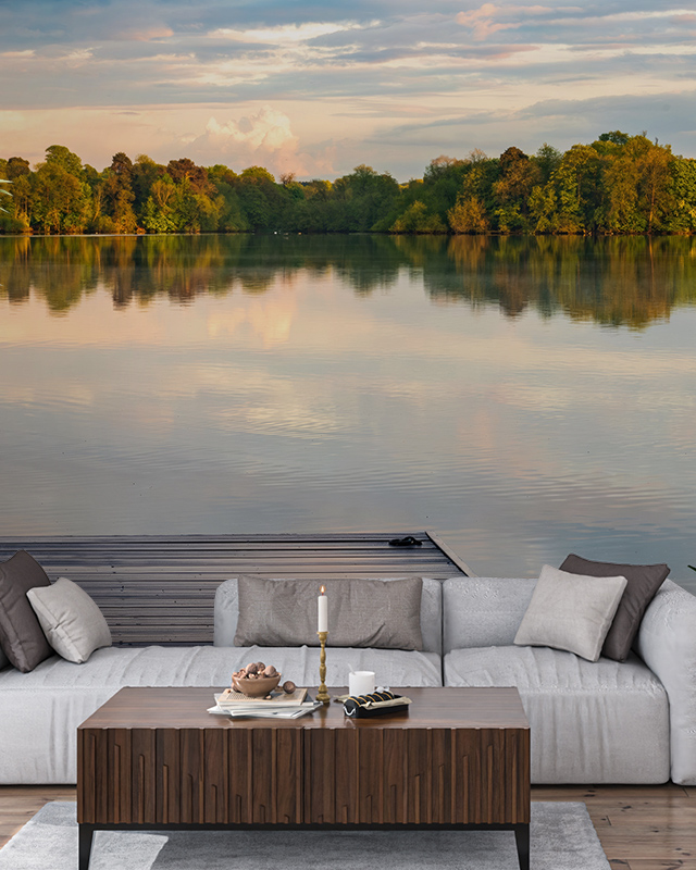 living-room-with-gray-sofa-wooden-table-and-a-serene-lake-view-mural-featuring-bright-wallpaper-for-small-spaces Living room with gray sofa, wooden table, and a serene lake view mural, featuring bright wallpaper for small spaces.