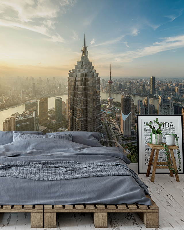 skyscraper-cityscape-with-a-sunset-view-as-bright-wallpaper-on-accent-walls-adding-depth-and-elegance-to-the-bedroom Skyscraper cityscape with a sunset view as bright wallpaper on accent walls, adding depth and elegance to the bedroom.